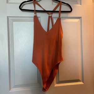 Burnt orange bodysuit from Forever 21. Size Medium.